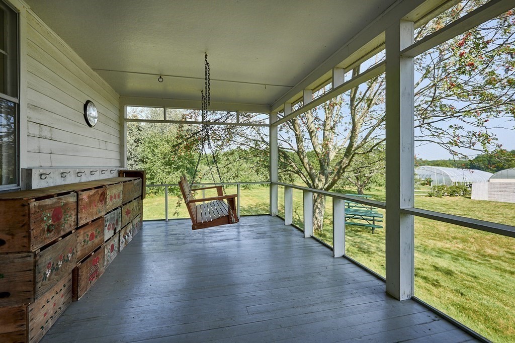 416 Bay Road Amherst, MA 01002 - Photo 19 of 42 an empty room with wooden floor and windows