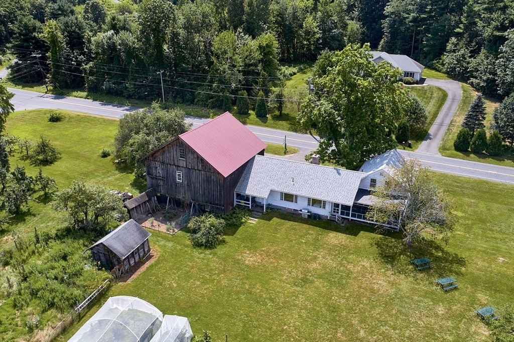 416 Bay Road Amherst, MA 01002 - Photo 2 of 42 a aerial view of a house with swimming pool and garden