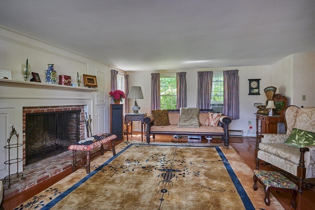 416 Bay Road Amherst, MA 01002 - Photo 9 of 42 a living room with furniture and a fireplace