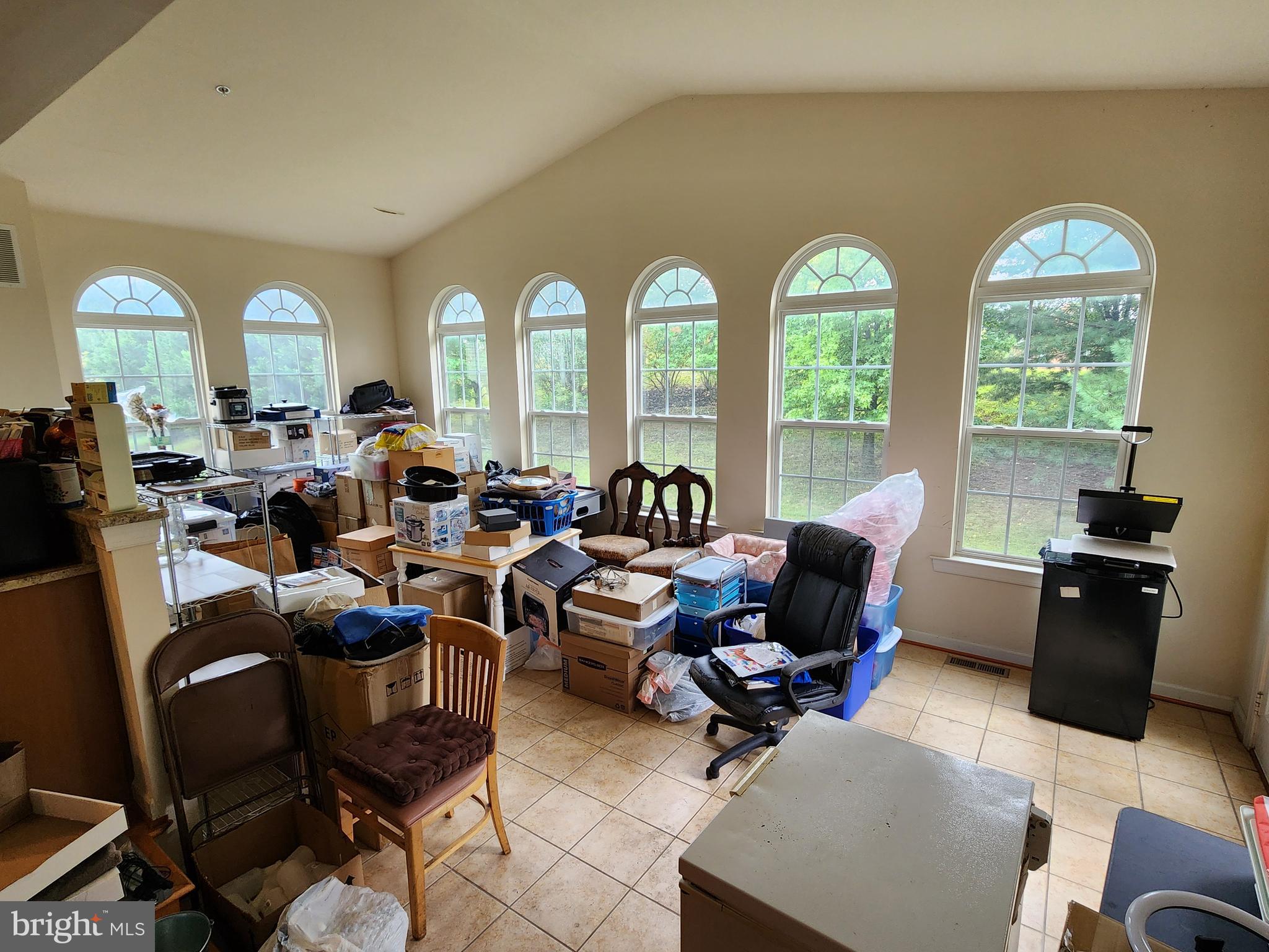 9815 Oxbridge Way Bowie, MD 20721 - Photo 16 of 28 a living room with lots of furniture and a large window