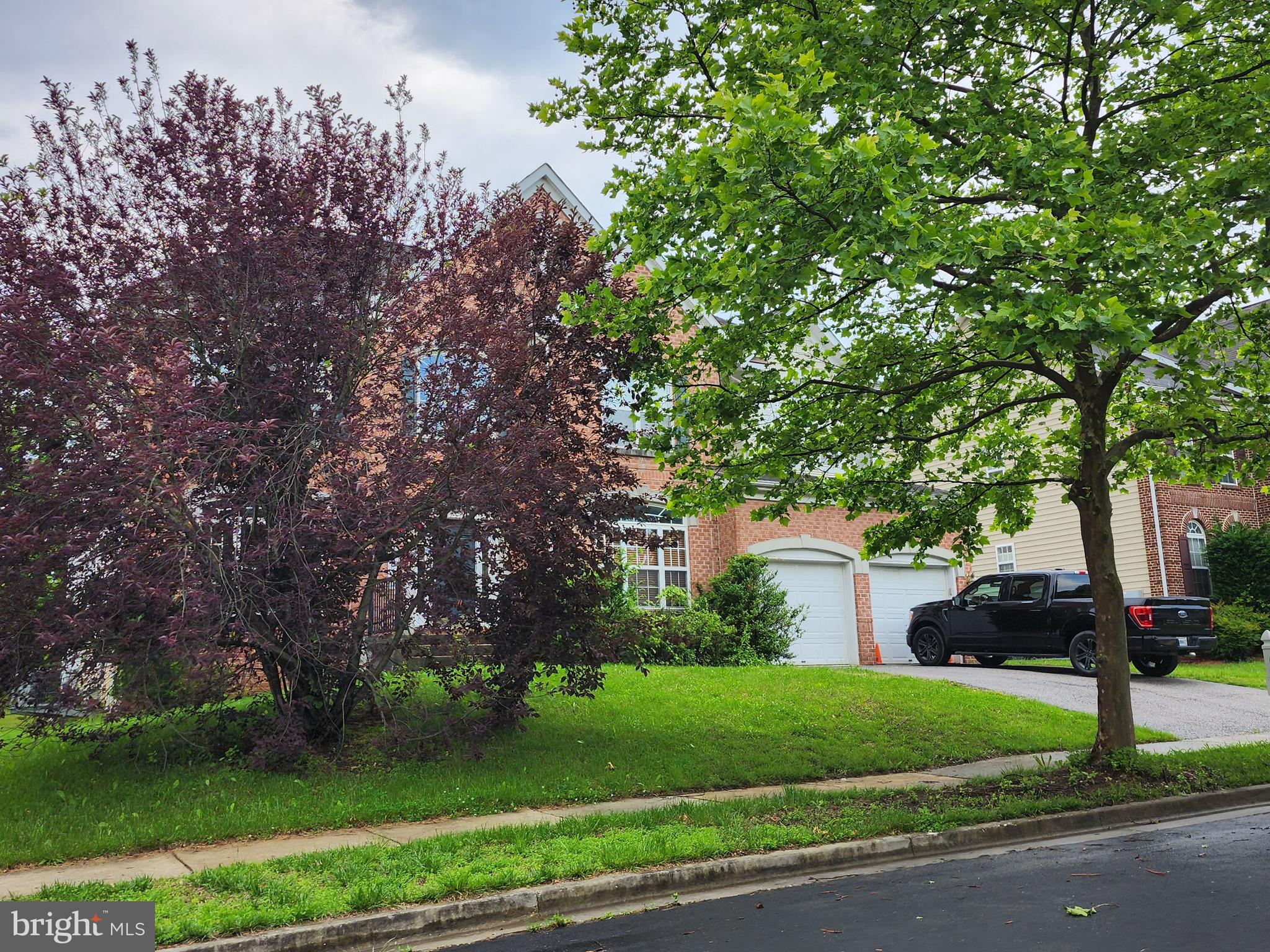 9815 Oxbridge Way Bowie, MD 20721 - Photo 25 of 28 a street view with a bench in the background