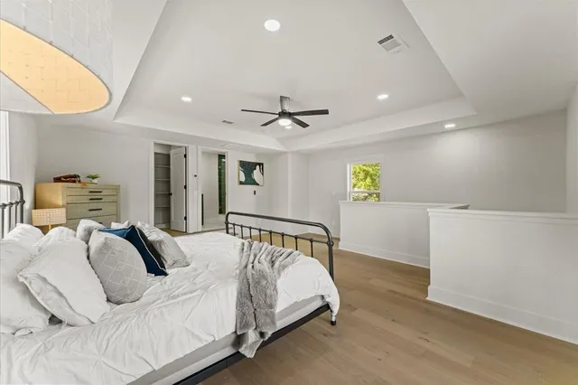 a bedroom with a bed and window