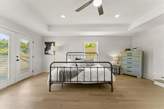 a bedroom with a bed and a view of room