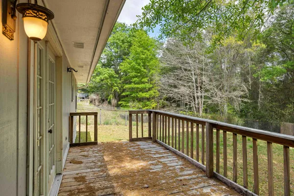 a backyard of a house with lots of trees