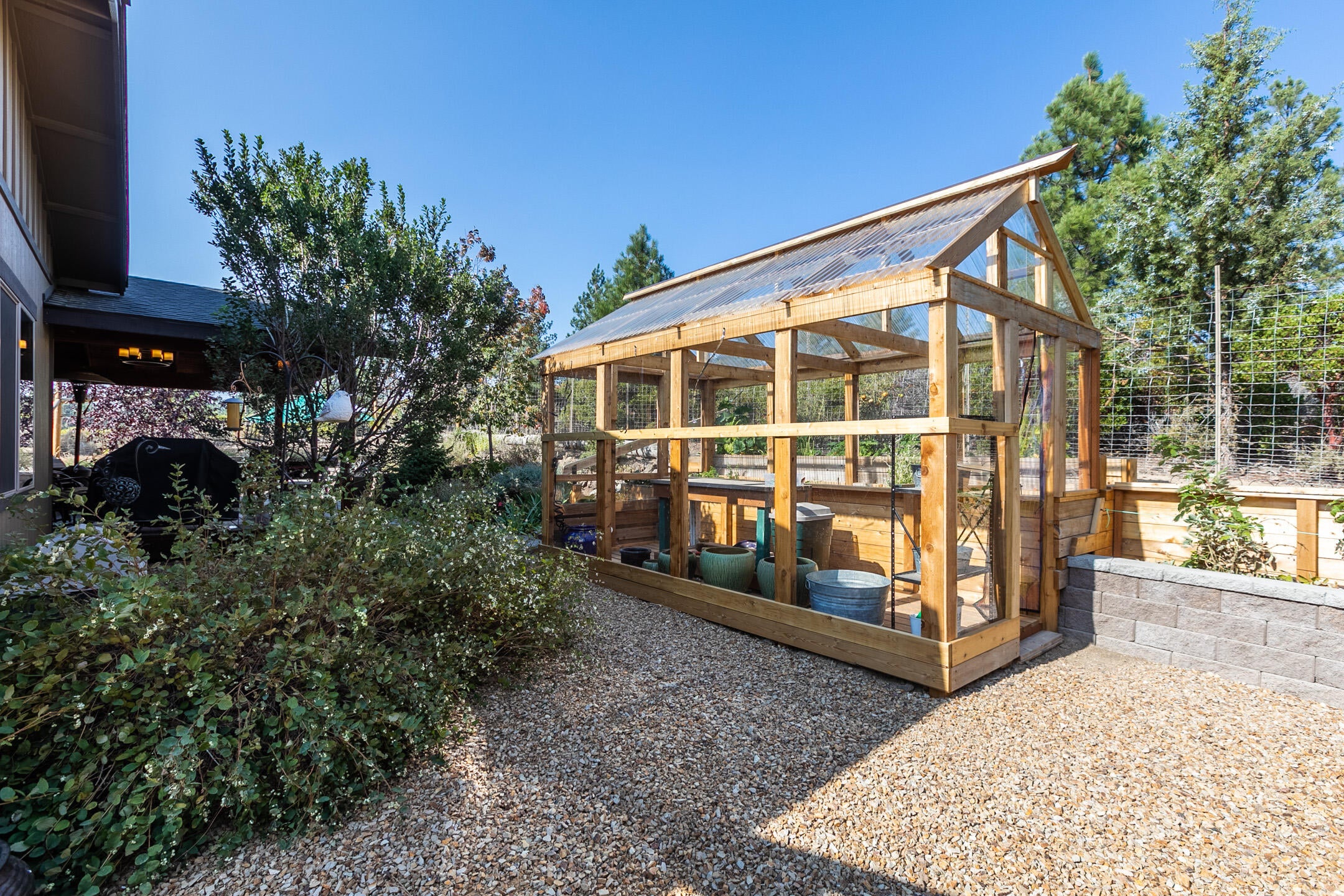 19088 Pumice Butte Road Bend, OR 97702 - Photo 5 of 39 19088 Back yard Greenhouse looking E to