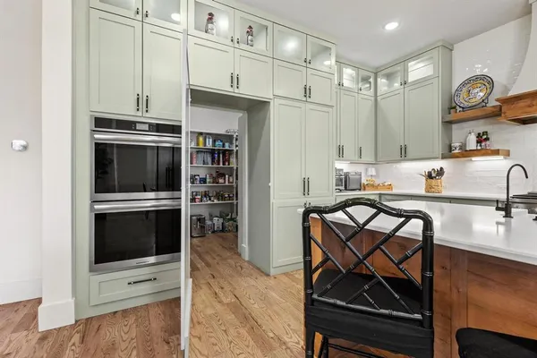 a kitchen with stainless steel appliances a stove a microwave and a refrigerator