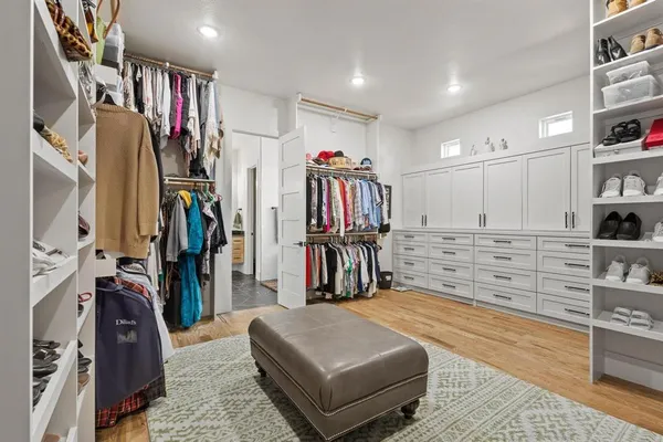 a living room with lots of furniture and closet