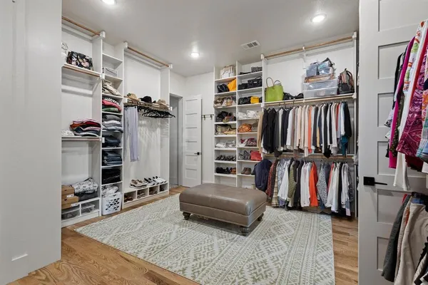 a living room with lots of furniture and gym equipment