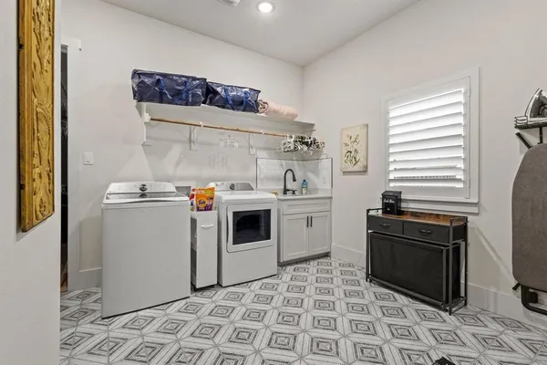 a view of a kitchen with stove top oven and cabinets