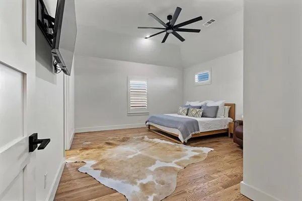 a living room with a bed furniture and a window