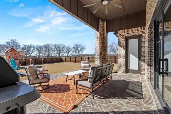 a view of a terrace with furniture