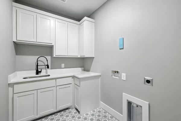 a close view of a sink and cabinets