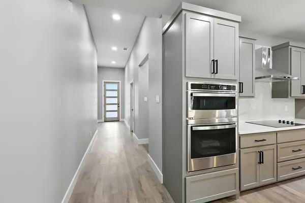a view of a kitchen with electric appliances
