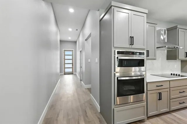 a view of a kitchen with electric appliances