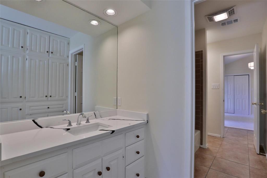 5717 Fm 2647 Winters, TX 79567 - Photo 17 of 37 a bathroom with a sink and a mirror