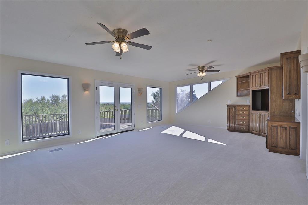 5717 Fm 2647 Winters, TX 79567 - Photo 26 of 37 a view of a livingroom with a ceiling fan and window