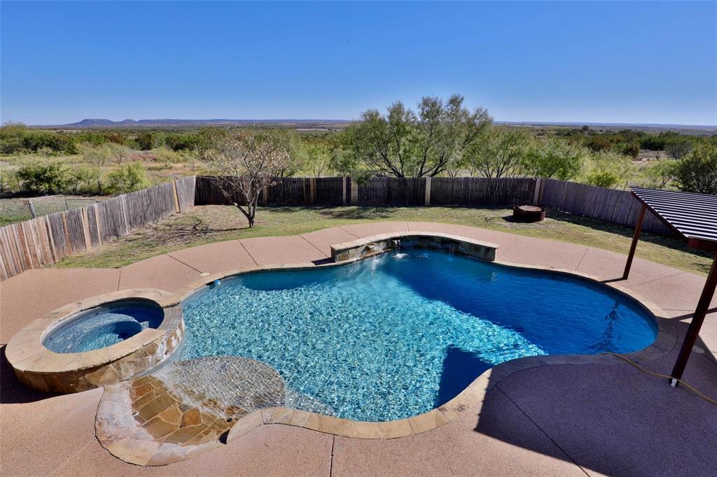 5717 Fm 2647 Winters, TX 79567 - Photo 31 of 37 a view of a swimming pool and lounge chairs