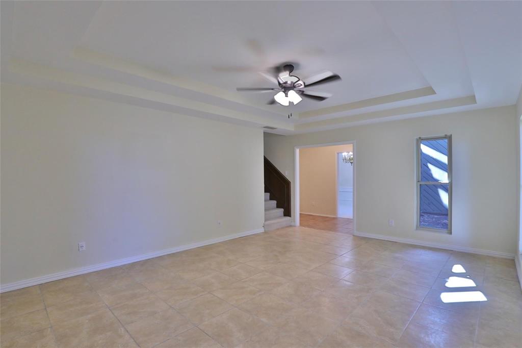 5717 Fm 2647 Winters, TX 79567 - Photo 5 of 37 wooden floor in an empty room with a window