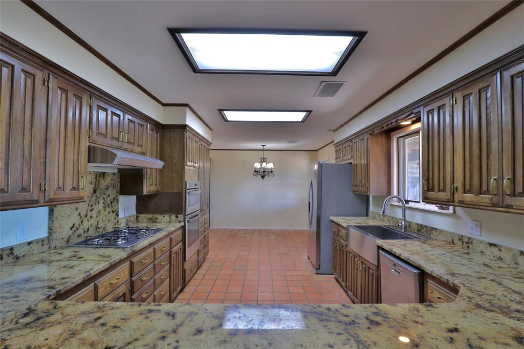 5717 Fm 2647 Winters, TX 79567 - Photo 9 of 37 a large kitchen with kitchen island granite countertop a large window