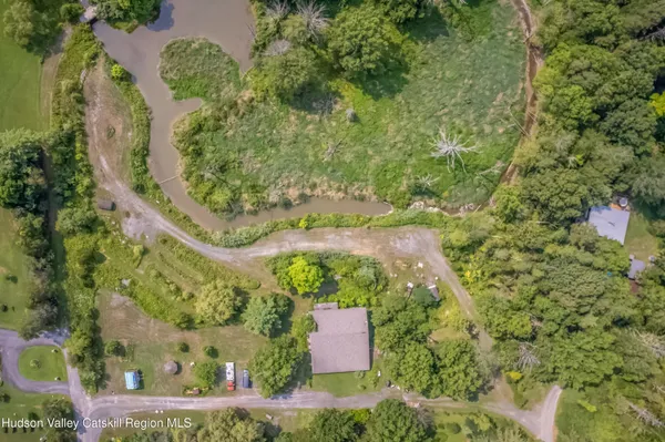 an aerial view of a residential houses with outdoor space