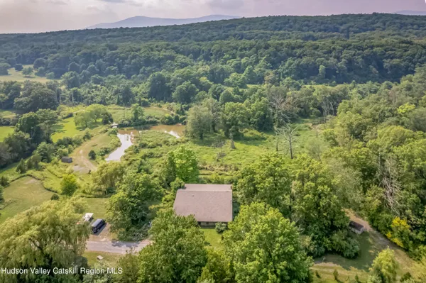 a aerial view of a house with a yard