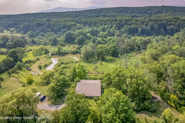 a aerial view of a house with a yard