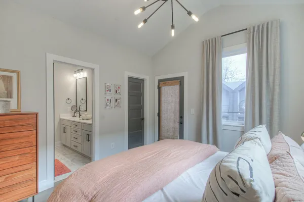 a bathroom with double vanity sinks and a mirror