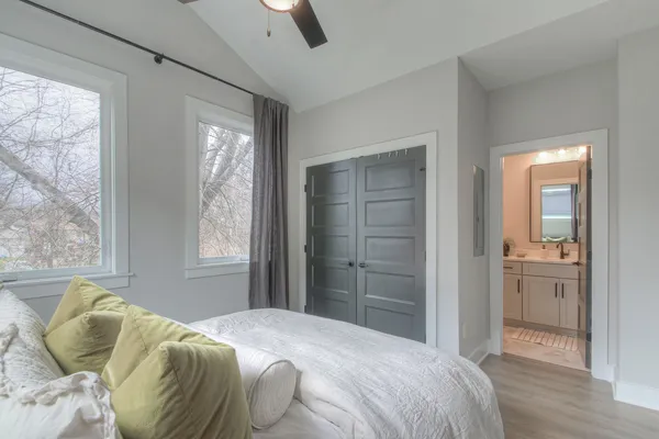 a bathroom with a sink toilet a mirror and shower