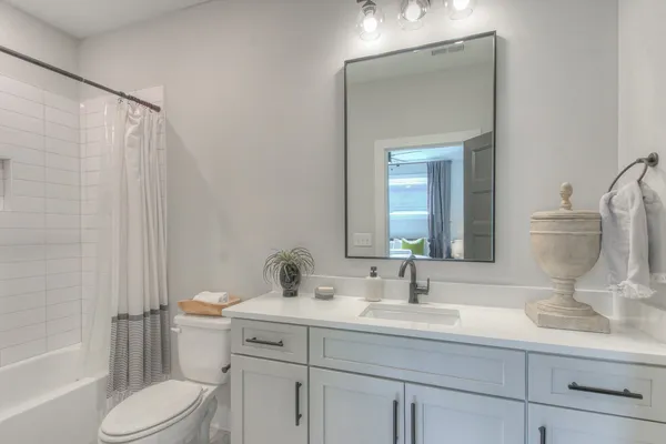 a bathroom with a bathtub and shower