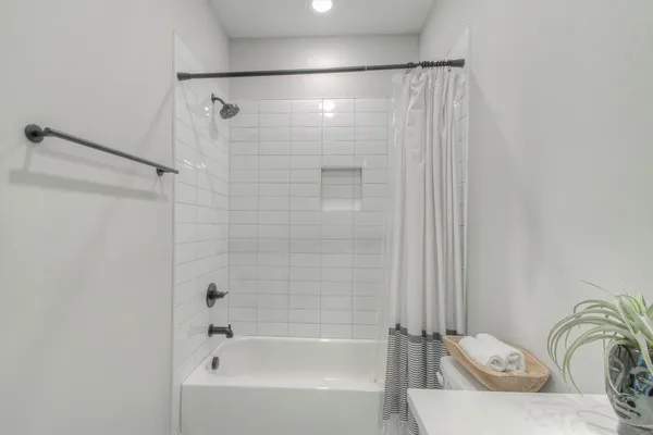 a bedroom with a bed and a mirror