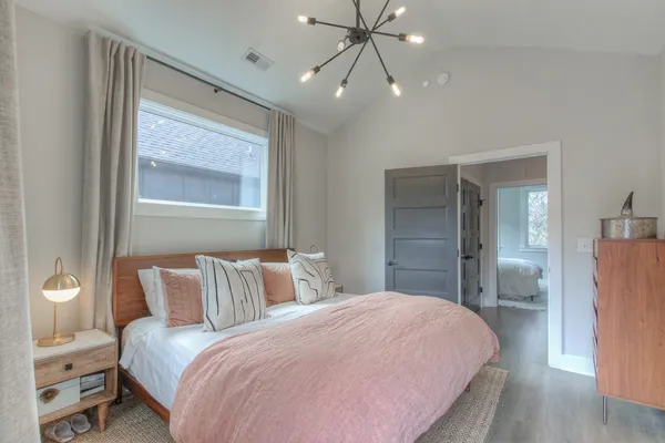 a lamp that is sitting on a bed in a balcony