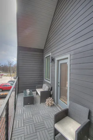 a view of a patio with couches chairs and potted plants