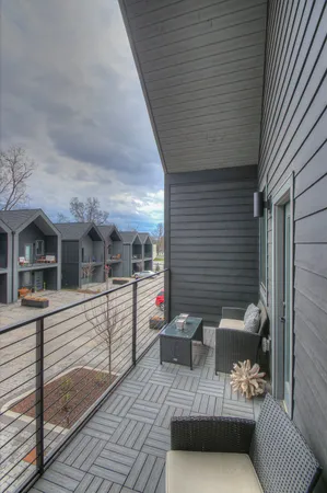 a room that has a bed and a chair in it