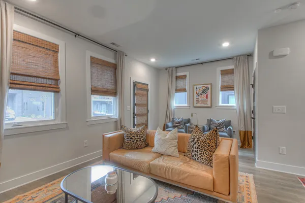 a living room with furniture and a window