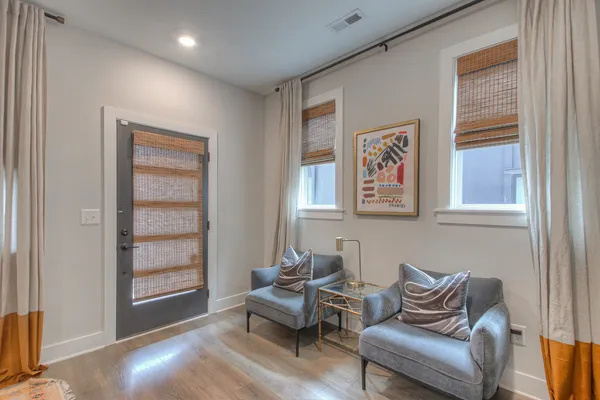 a living room with furniture and a window