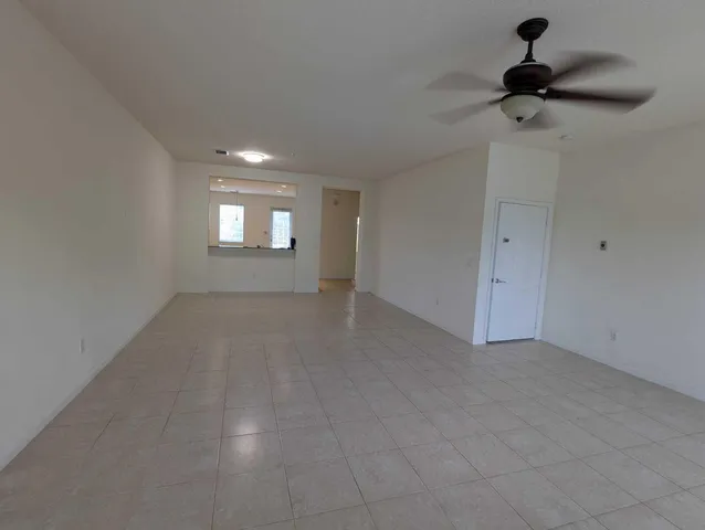 a view of empty room with windows