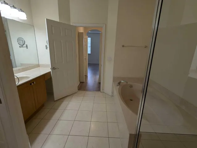a bathroom with a glass door shower