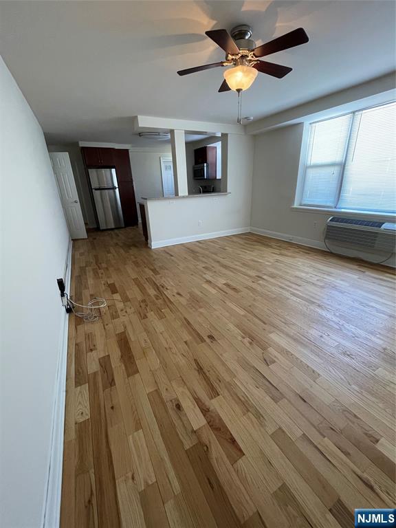 280-320 Oak Street, Unit 306TG Ridgewood, NJ 07450 - Photo 6 of 22 a view of empty room with wooden floor and fan