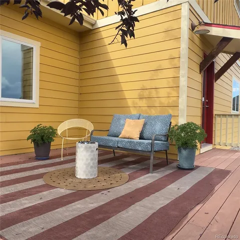 a view of a backyard with wooden fence