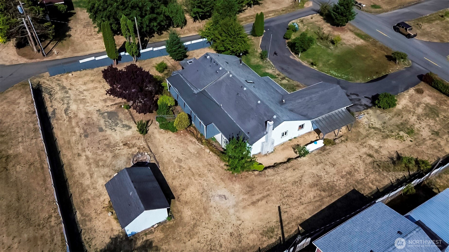 an aerial view of house with yard