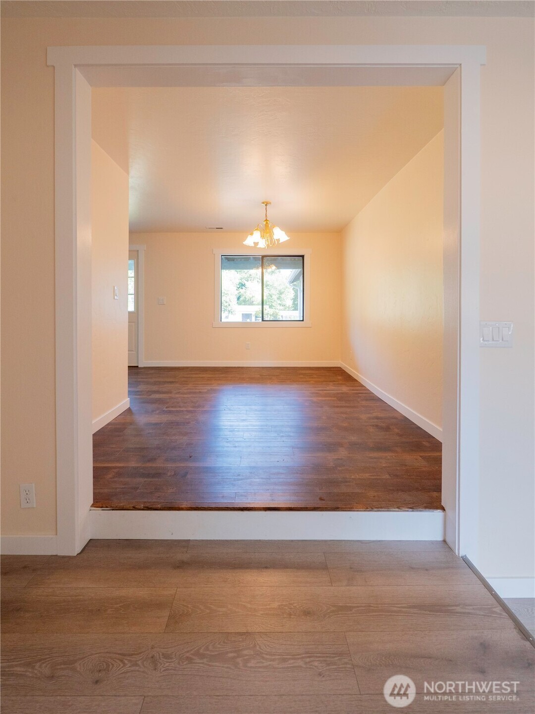 500 Mill Creek Road Southeast Shelton, WA 98584 - Photo 14 of 39 an empty room with wooden floor cabinet and hallway