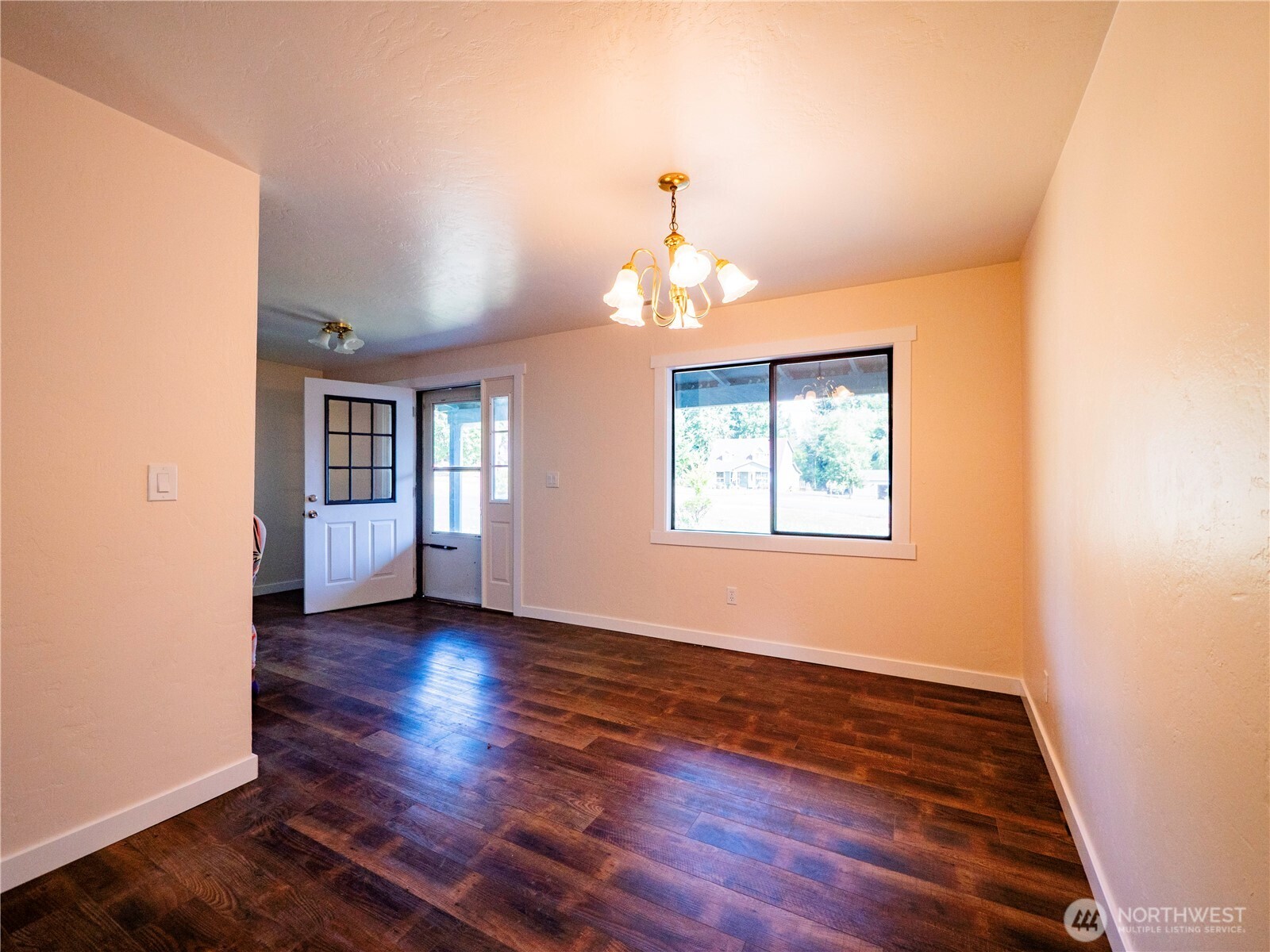 500 Mill Creek Road Southeast Shelton, WA 98584 - Photo 15 of 39 an empty room with wooden floor chandelier and windows