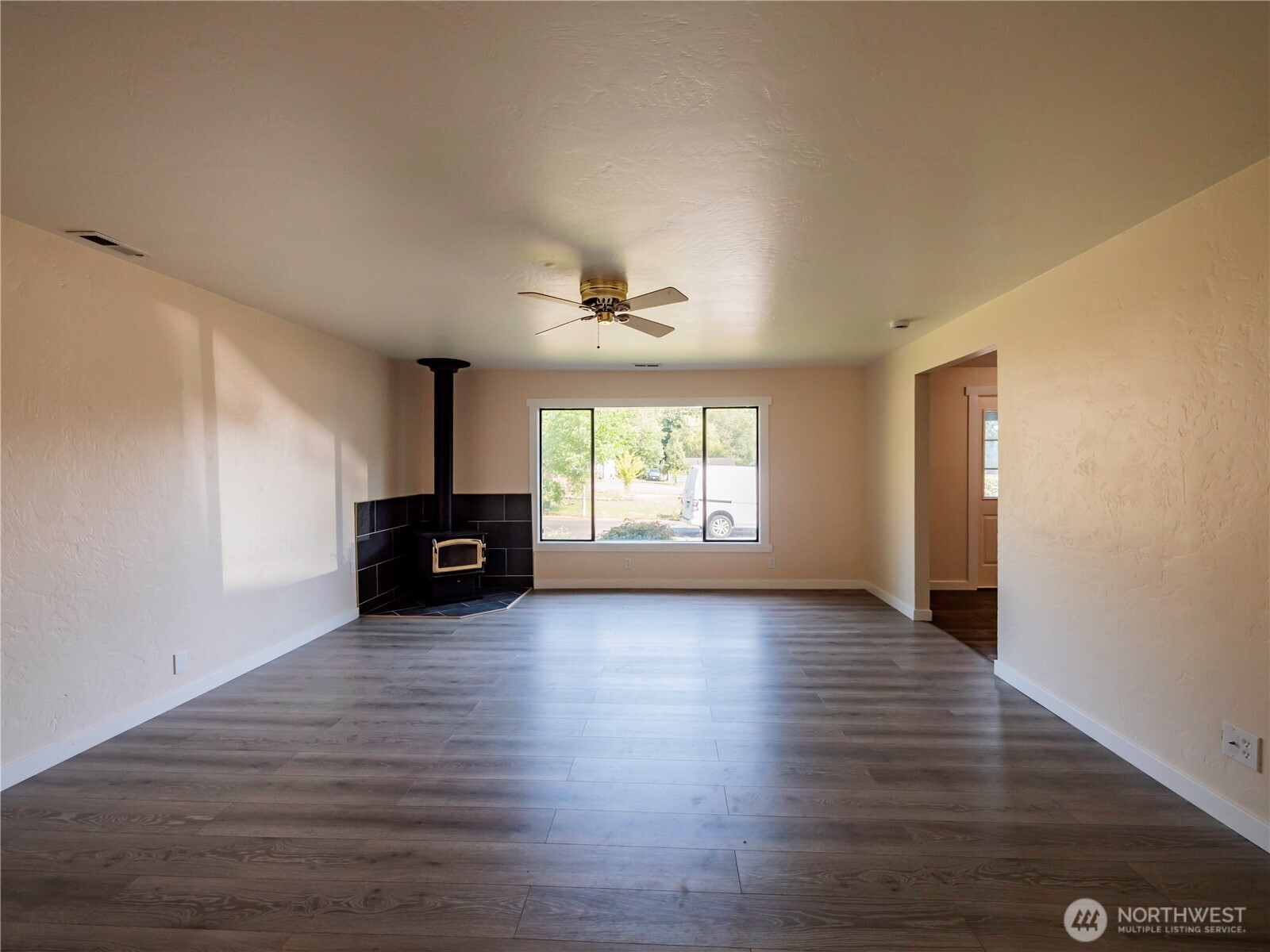 500 Mill Creek Road Southeast Shelton, WA 98584 - Photo 20 of 39 a view of empty room with wooden floor and fan