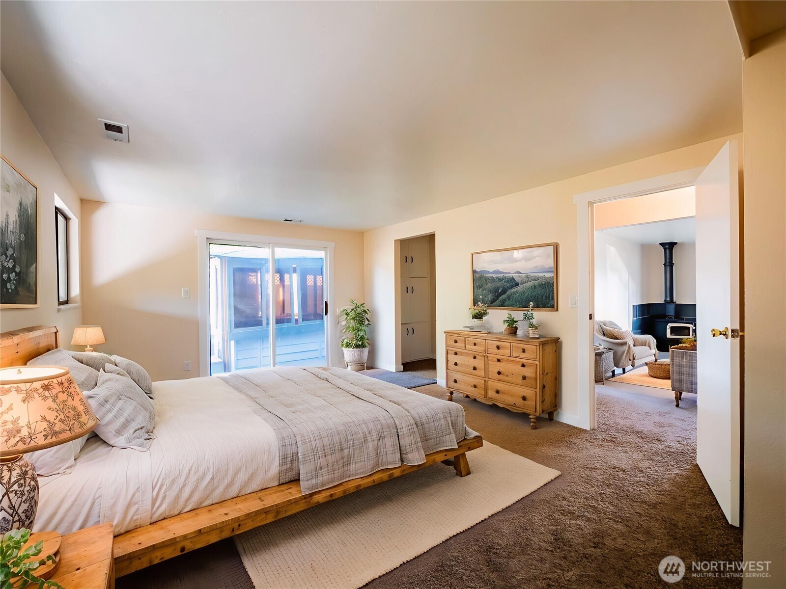 500 Mill Creek Road Southeast Shelton, WA 98584 - Photo 23 of 39 a bedroom with a bed and large windows