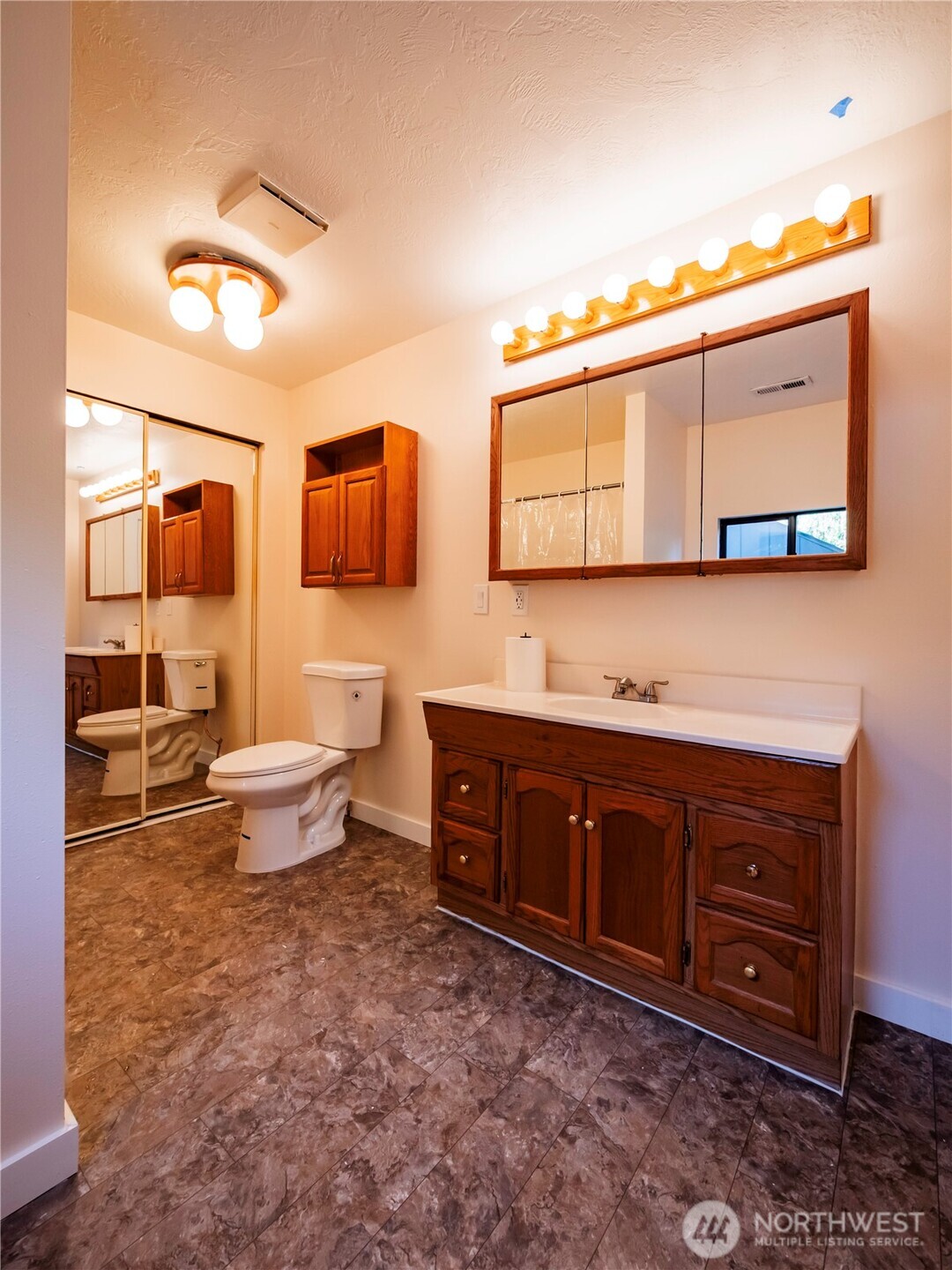 500 Mill Creek Road Southeast Shelton, WA 98584 - Photo 27 of 39 a spacious bathroom with a toilet sink and mirror