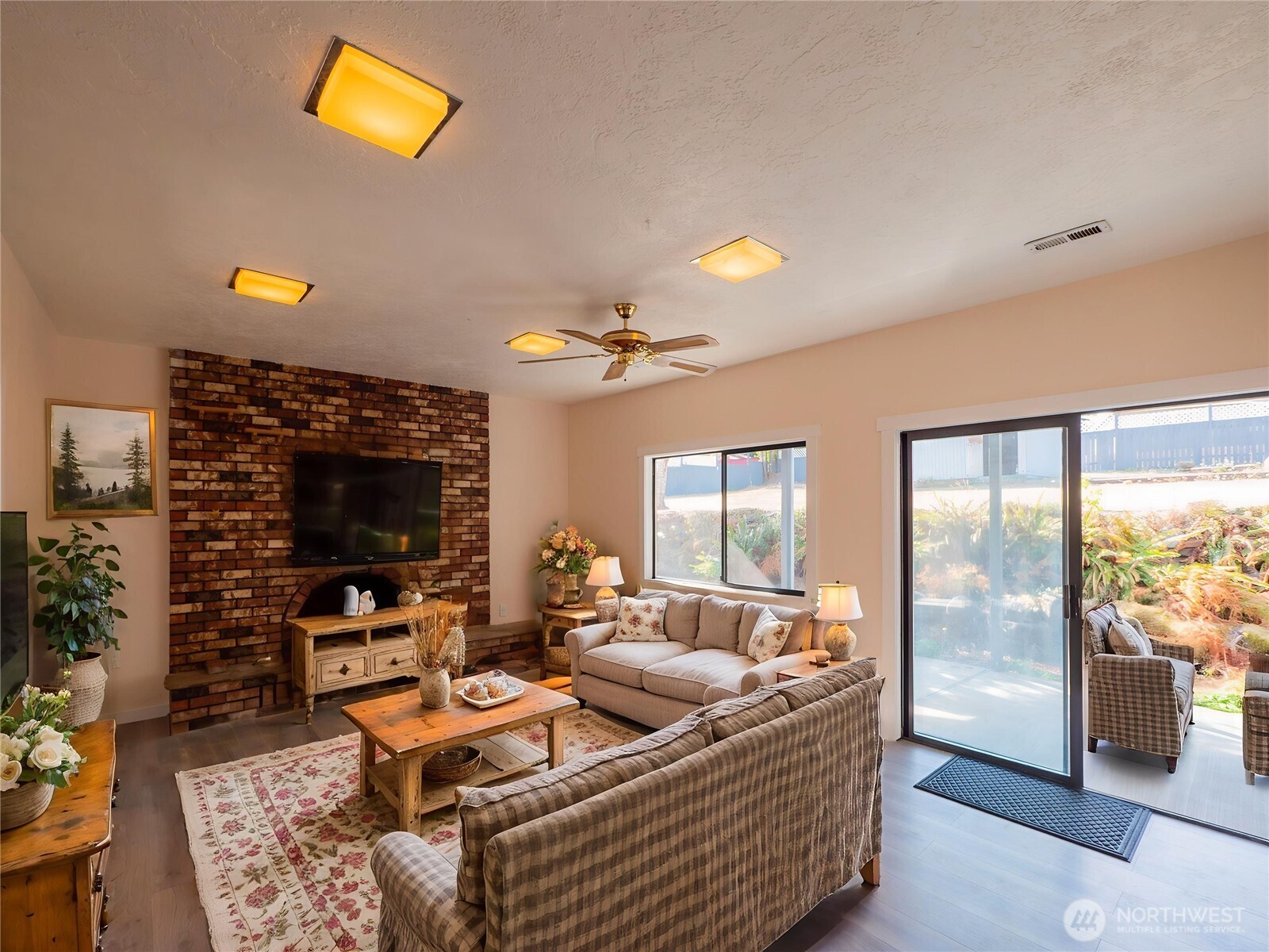 500 Mill Creek Road Southeast Shelton, WA 98584 - Photo 29 of 39 a living room with furniture and a flat screen tv