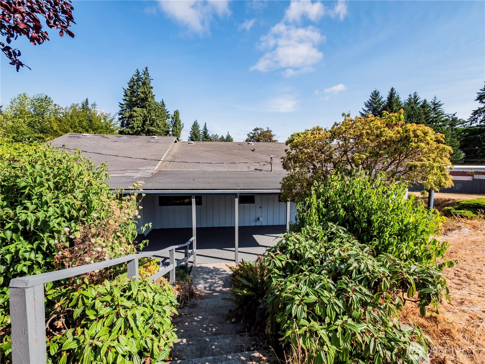 500 Mill Creek Road Southeast Shelton, WA 98584 - Photo 37 of 39 a front view of a house with a garden