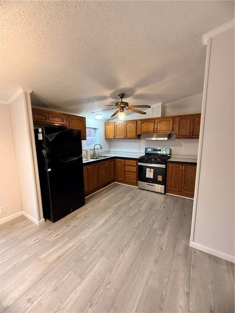 307 West 7th Street St. Elmo, IL 62458 - Photo 11 of 17 a kitchen with stainless steel appliances a stove and refrigerator