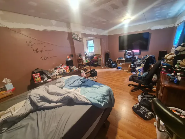 a living room with furniture and a mirror