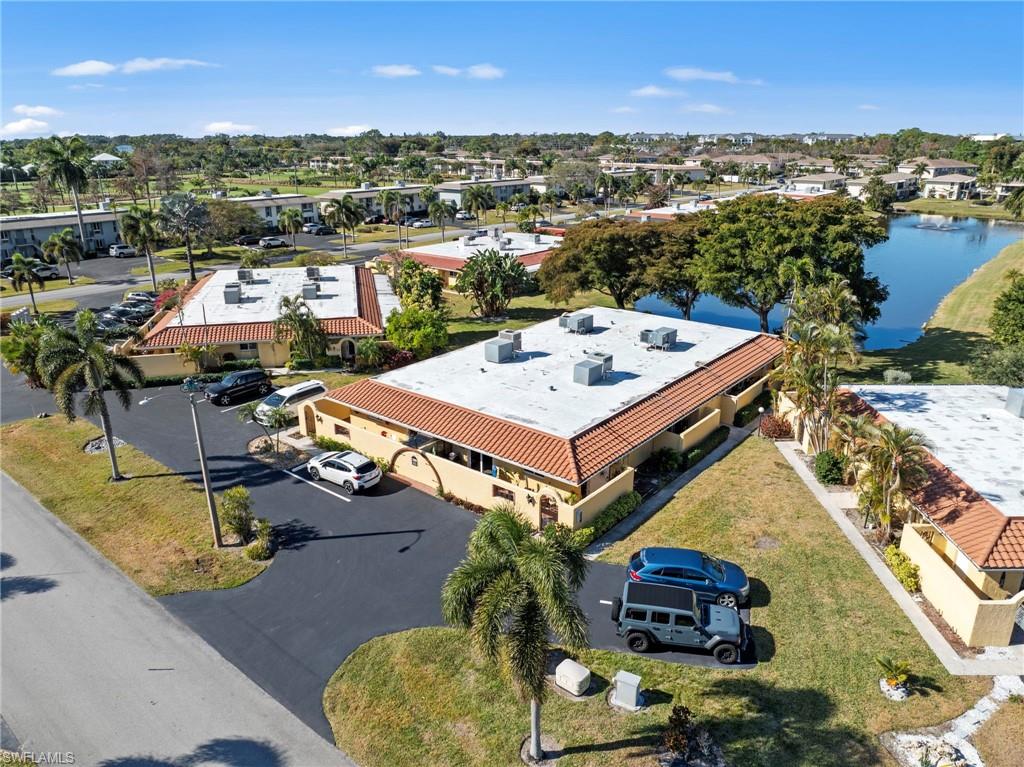 an aerial view of a house with yard swimming pool and outdoor seating